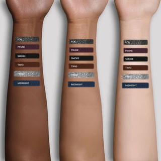 Model arms with applied swatch of Mirabella Eye Definer on 3 diverse skin tones of 6 shade range options.