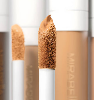 Close-up of Mirabella Beauty Invincible Concealer with doe-foot applicator, highlighting its smooth texture for precise application.