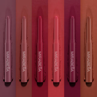 Image of Mirabella's Velvet Lip Crayons 6 bold shade offerings laying on top of the shade to show the different color variations.