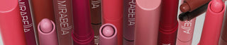 A banner image of Mirabella's new Velvet Lip Crayon showing the different shades and longwear matte formula.