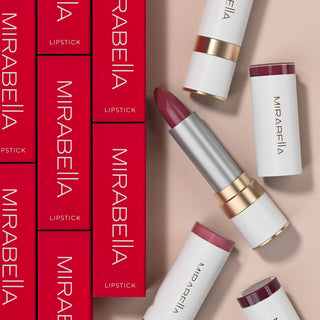 Image showcasing Mirabella's Sealed With A Kiss Lipstick moisturizing lip stick packaging alongside opened white tubes.